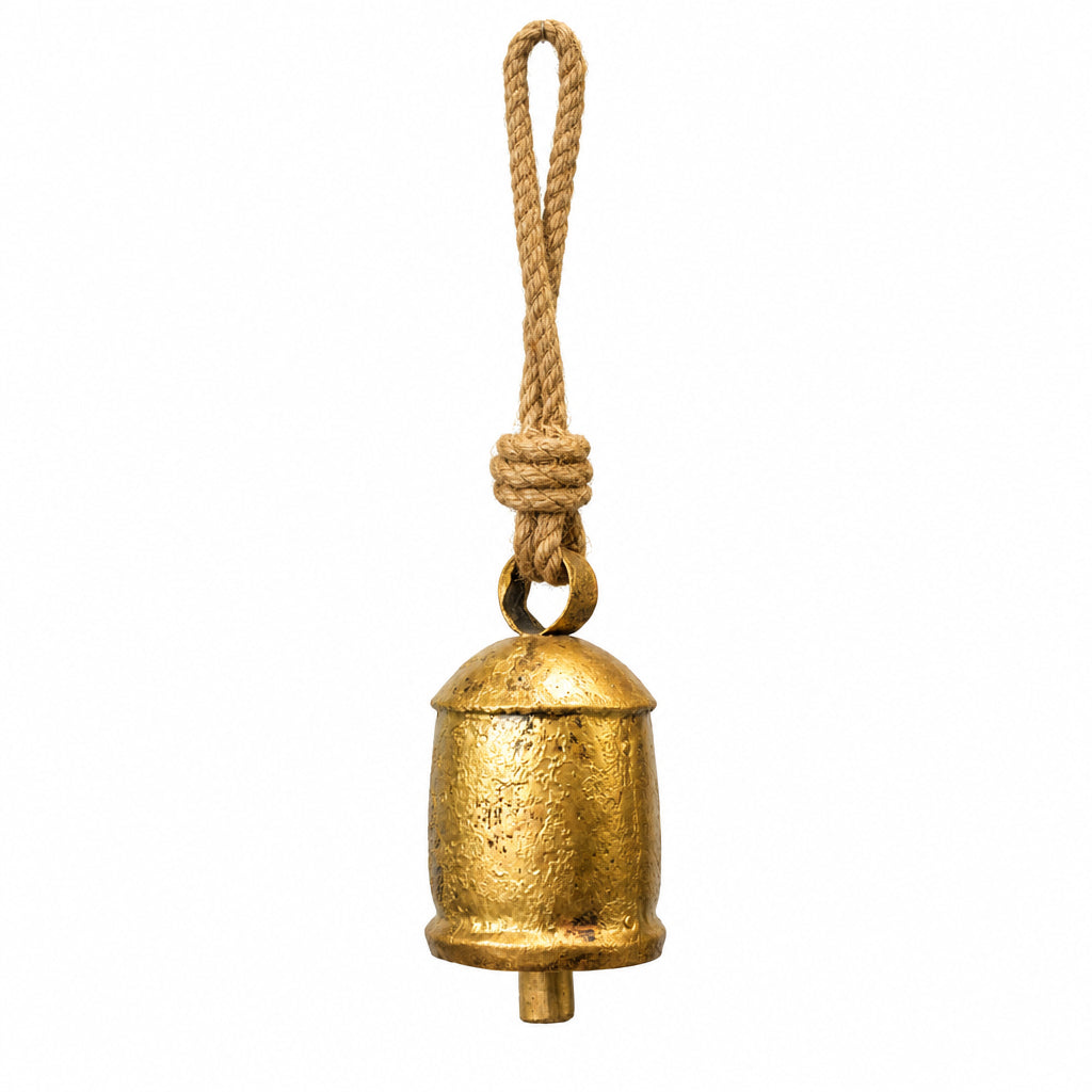 A small rustic brass bell with a thick natural jute rope hanger, on a white background.